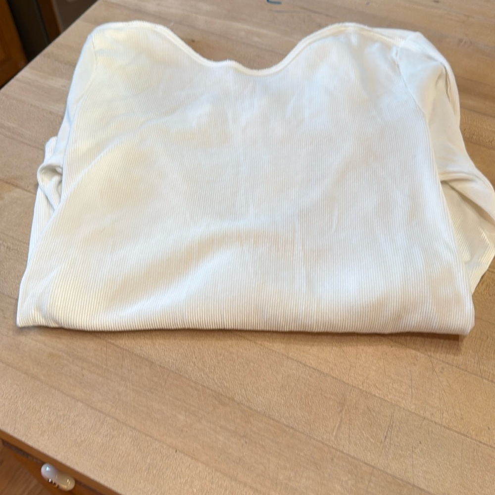 Size Large We The Free long sleeve top with low back and  notched out wrist